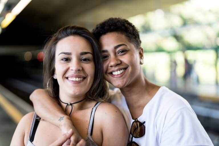 Portrait of Young Lesbian Couple at Subway Station