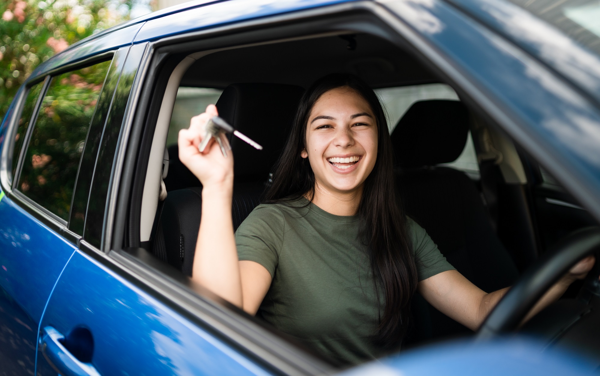 Young new driver in car