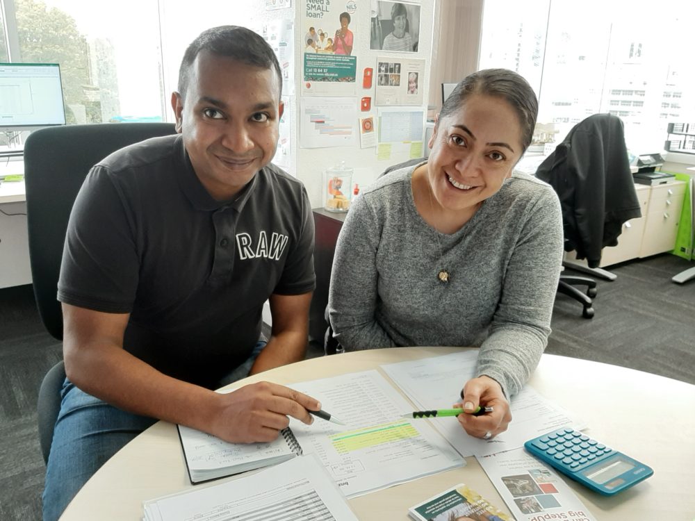 Couple with paperwork at table