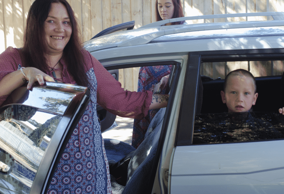 Woman by car