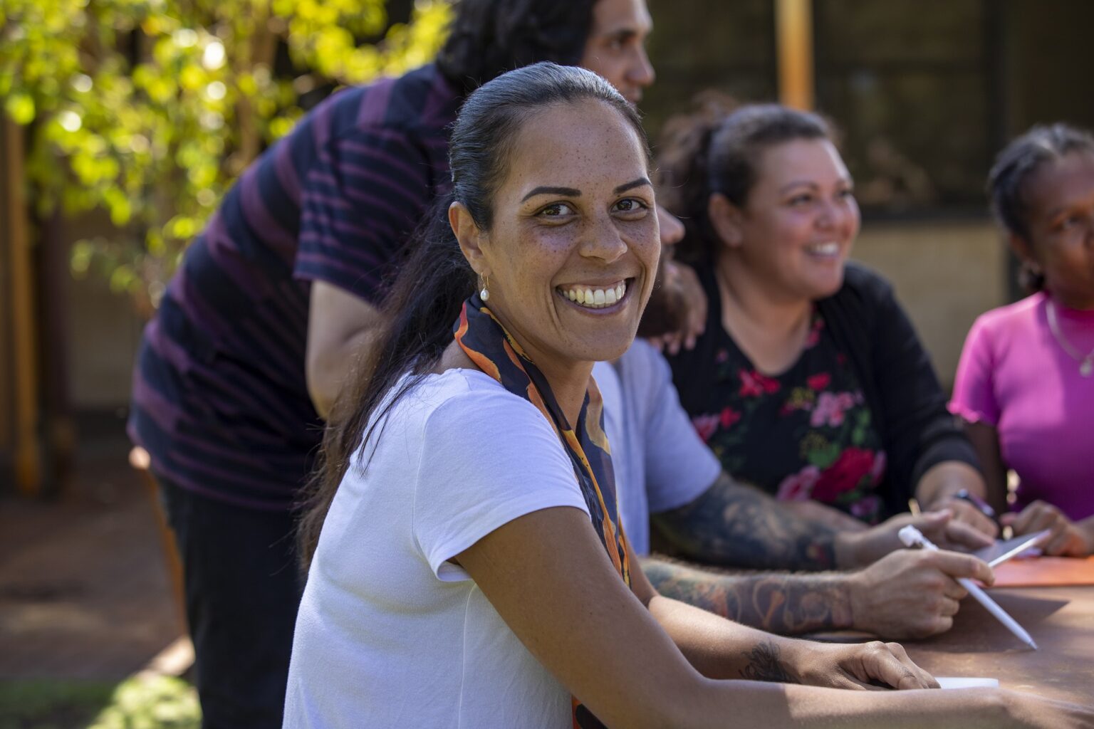 Woman at table smiling