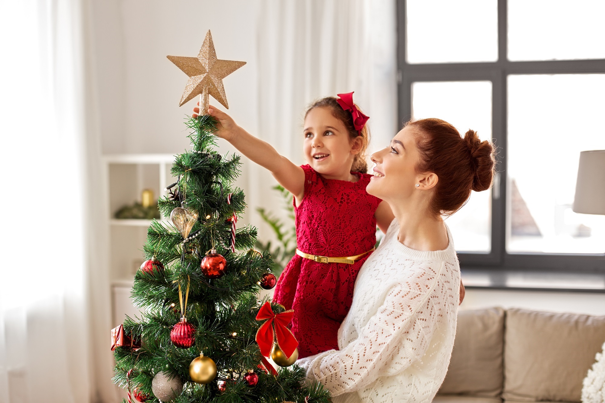 Mother and kid with xmas tree