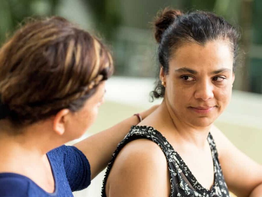 Two woman supporting each other